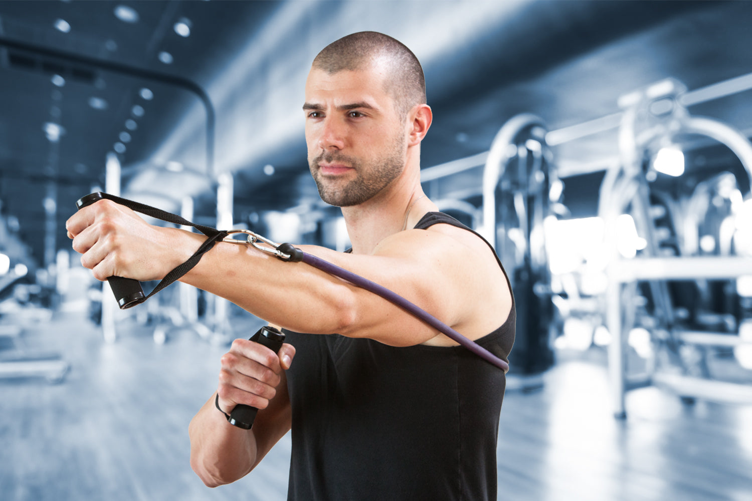 man using resistance band in a gym