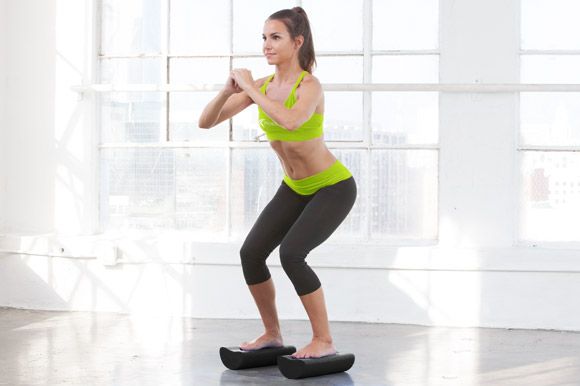 woman sitting with prosourcefit foam roller
