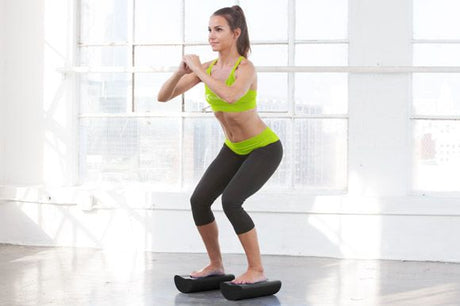 woman sitting with prosourcefit foam roller