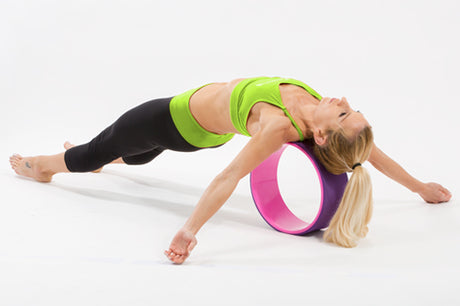 woman using prosourcefit yoga wheel to open chest