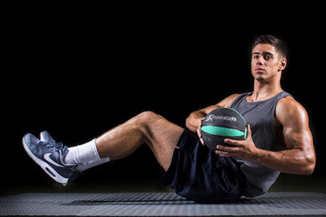 man using prosourcefit rubber medicine ball for ab workout