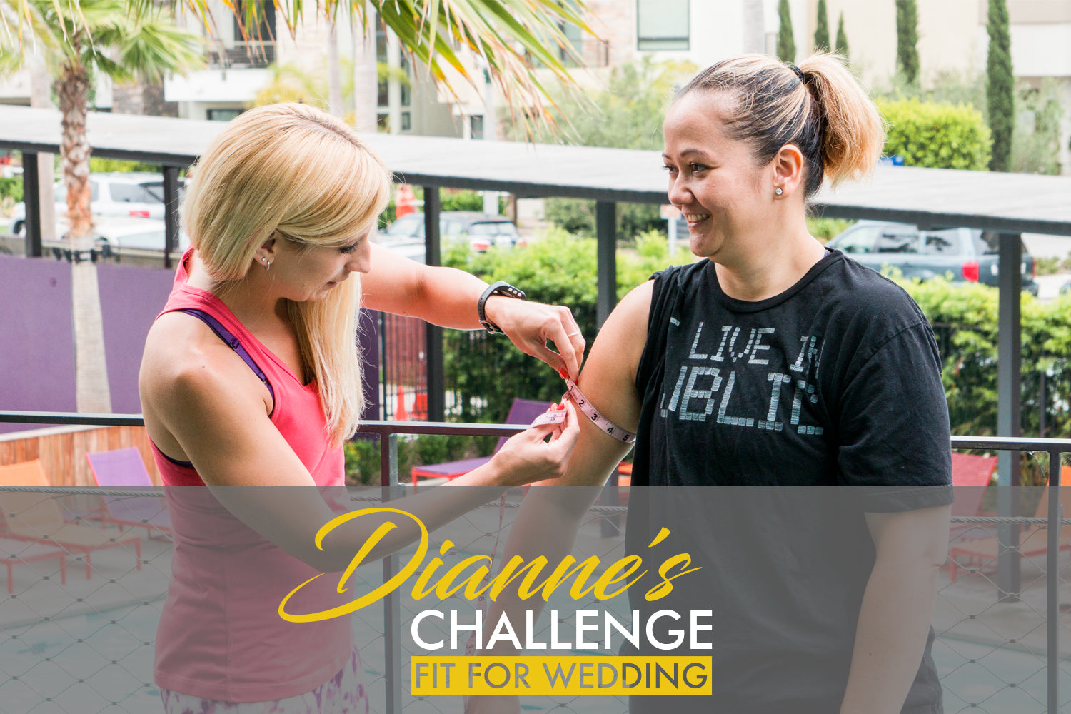 Trainer making arm measurements on client