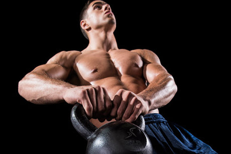 man holding prosourcefit cast iron kettlebell