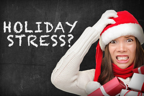 Woman with santa hat and gifts on ProsourceFit blog