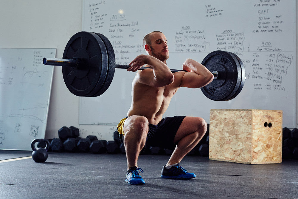 man doing squat thruster